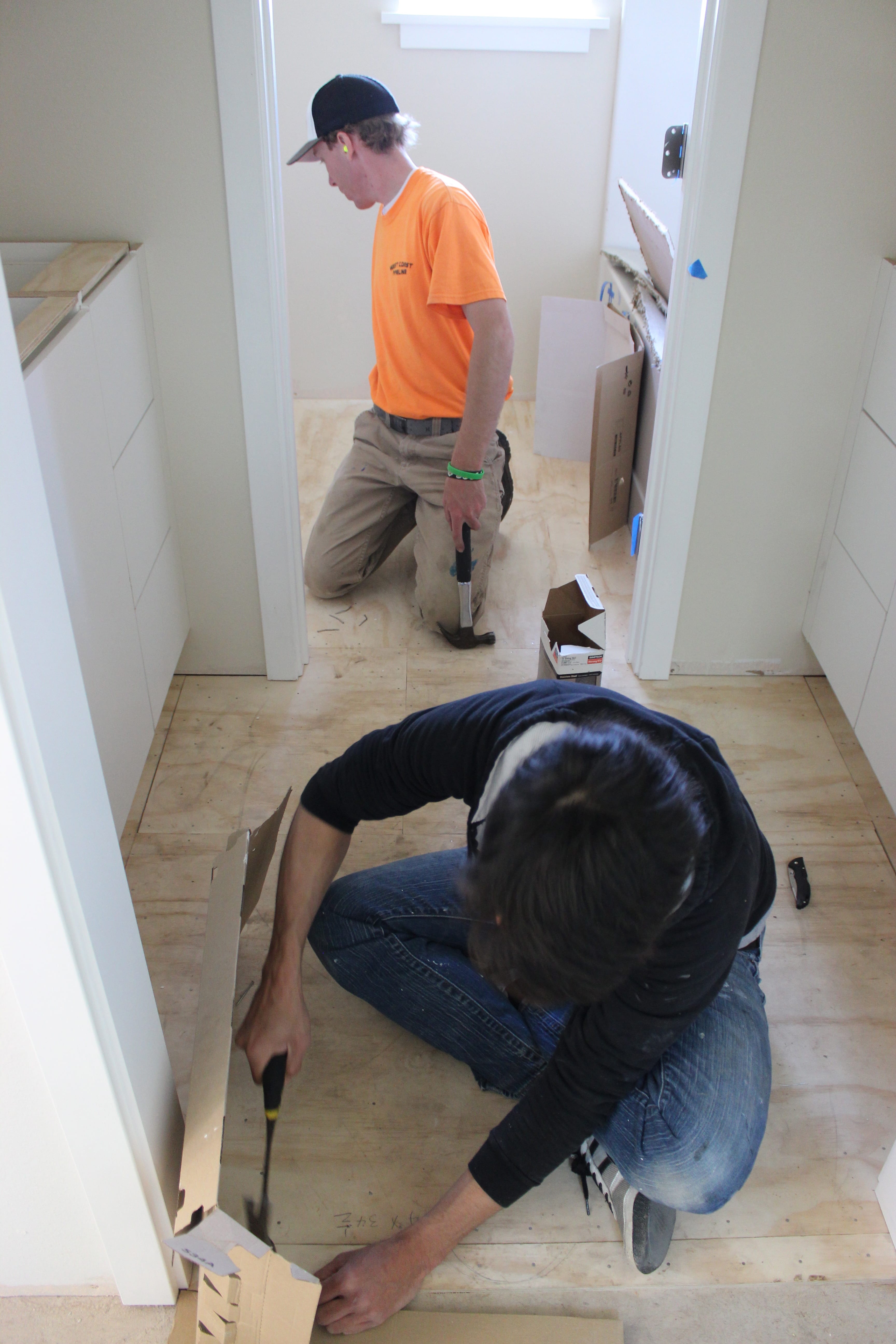 Nailing the plywood in the bathroom
