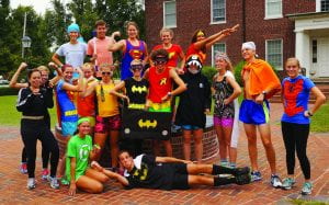 Members of the Cross Country team pose prior to the annual Theme Run through campus. The theme for this year was famous superheros