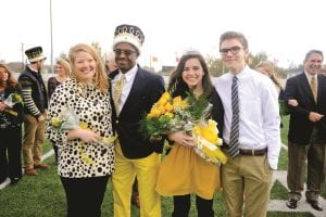 Seniors Emily Robbins, C.J. Donald, Jennifer Hormell, and Hormell’s brother David all celebrate Donald and Hormell’s Homecoming win.