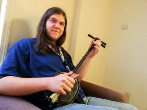 Junior Nick Teale sits with his shamisen, one of the instruments that he has used in order to record the songs of his concept music album, which consists of two separate movements.