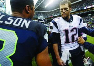 Seahawks Quarterback Russel Wilson and Patriots Quarterback Tom Brady exchange words after the Seahawks suffered a devstating loss.