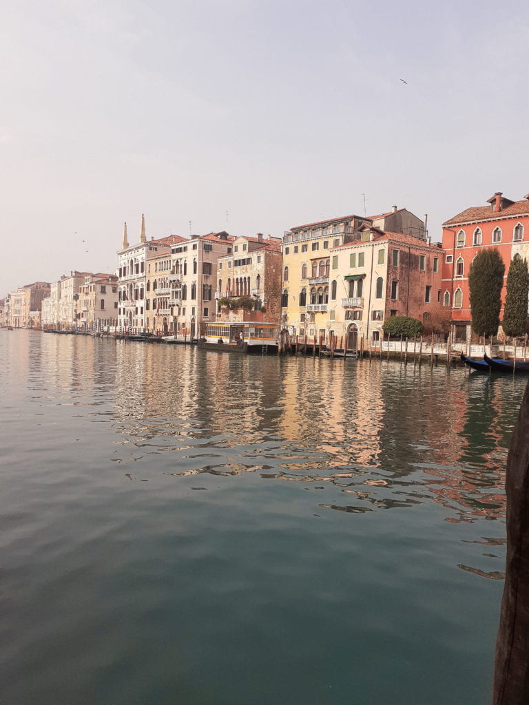 The Grand Canal on a sunny day, as seen from a vaporetto station.