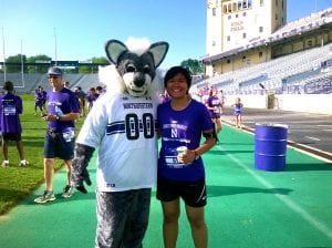 Posing with NU's mascot, Wildcat Wille at the Finish line in Ryan Field.