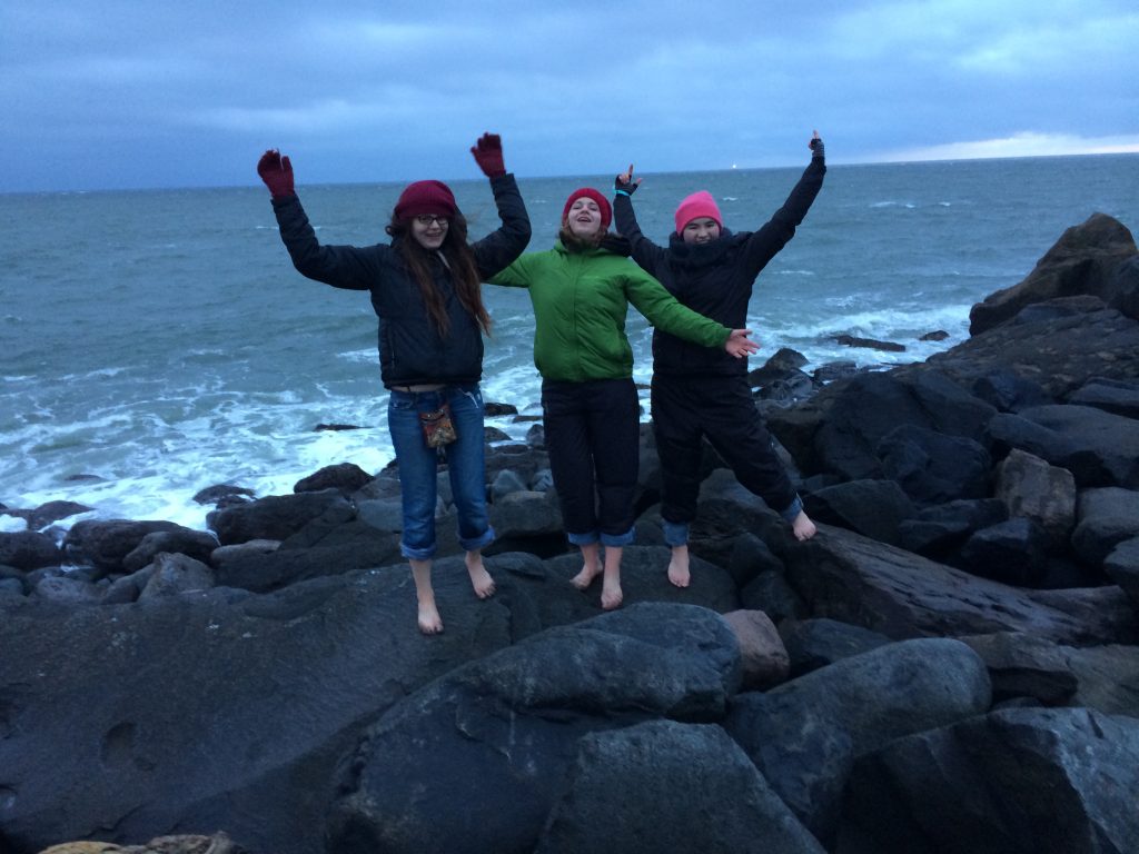 Angeline, Abby and Kaili enjoy the view at South Jetty after a long day of marine debris monitoring.