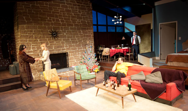 Photo shows mid-century modern stage set, with Elizabeth France entering at left in fur coat.