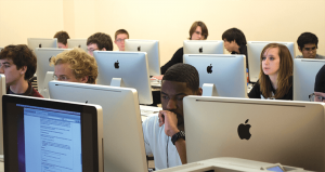 students in front of modern-day computers