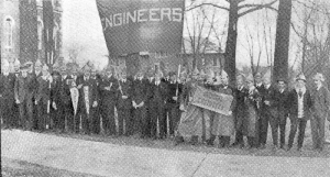 an old picture of a group of students holding a banner that says "Engineers"