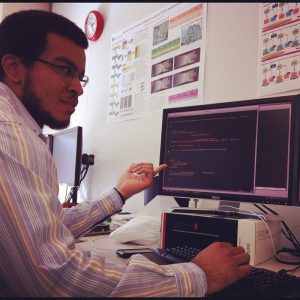 a student sitting in front of a computer