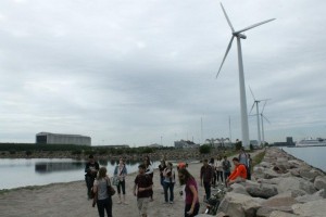 students next to a windmill