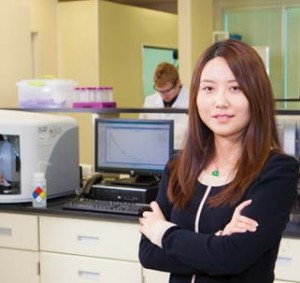 a woman standing in a lab