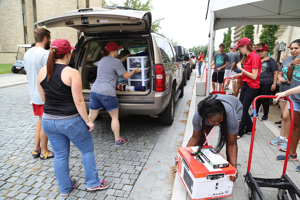 Volunteers help unload outside Founders on McIlroy Ave.