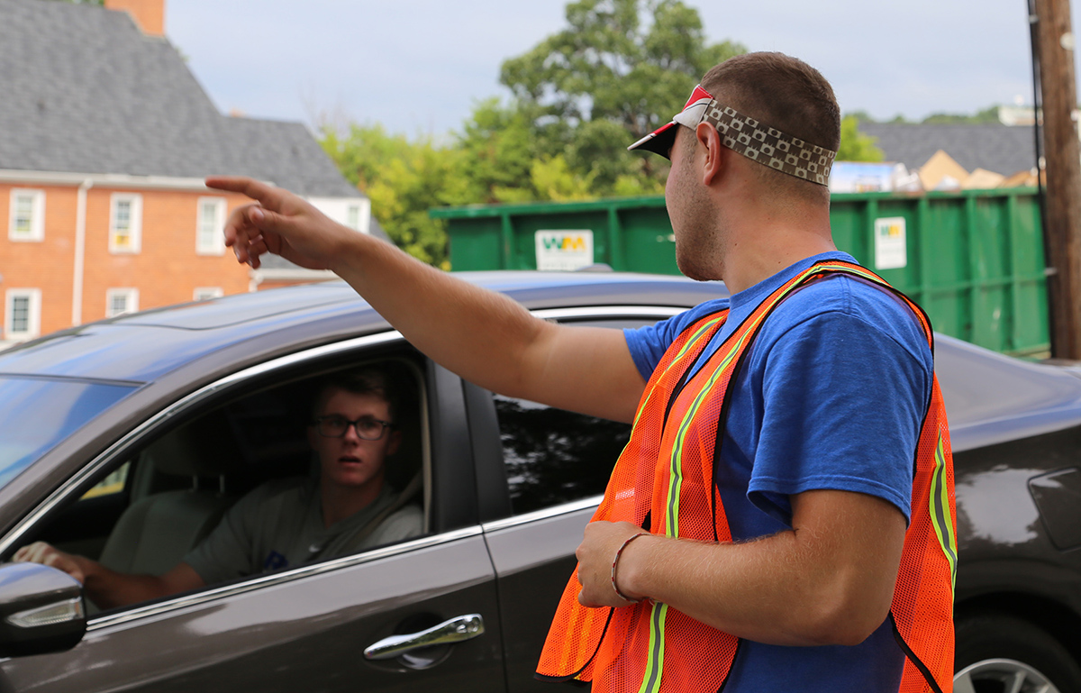 Thomas Klender, Walton RA, points south, the directi on of move-in parking.