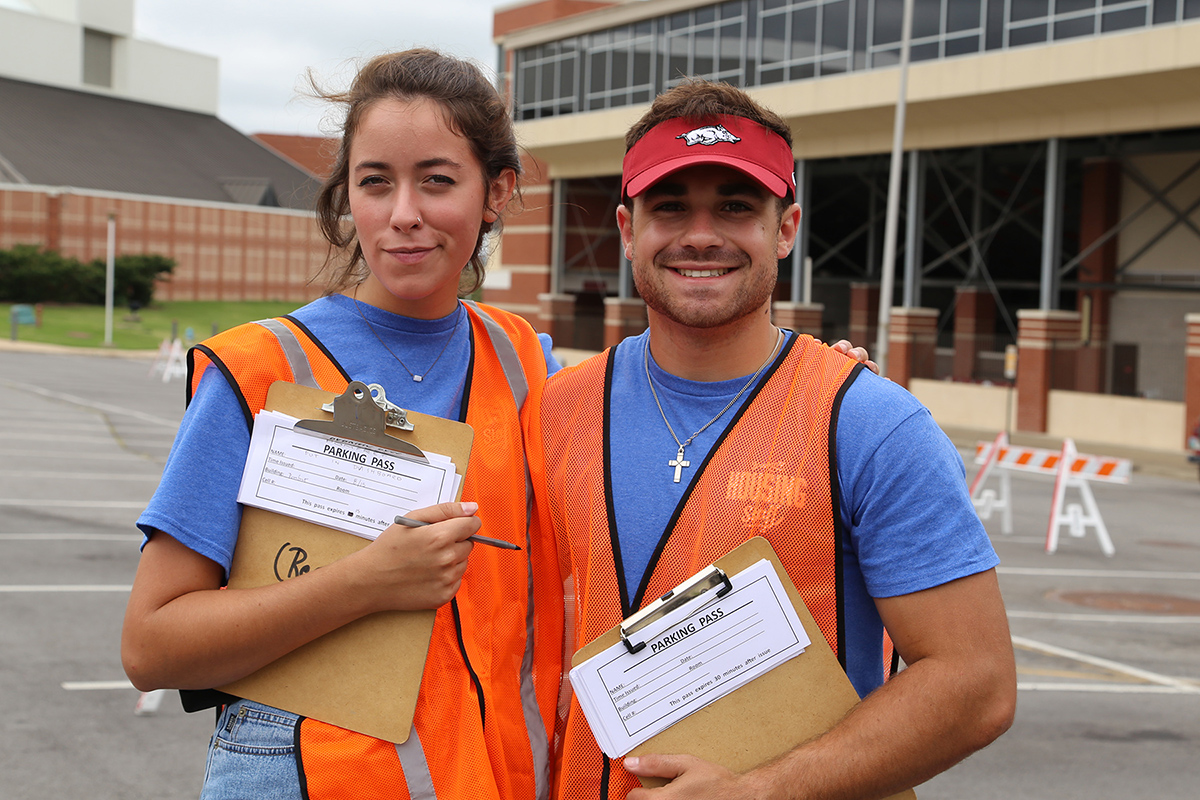 Hannah Biondolillo and Jake Stone, Pomfret RAs, register cars in Lots 55 and 64.