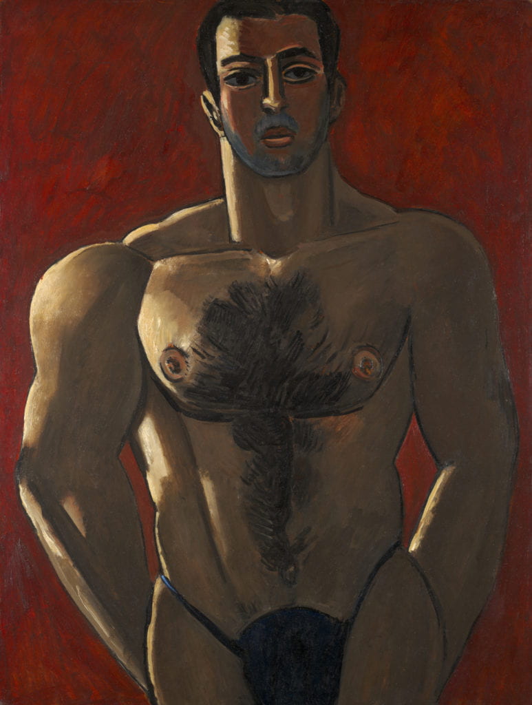 Hartley’s painting “Madawaska—Acadian Light Heavy” depicts a young light-heavyweight prizefighter in a closely-cropped frontal pose. The figure’s nude, muscular torso dominates much of the composition, and stands out against the vivid crimson background. Hartley uses black paint strokes to outline the figure’s bulging muscles, body hair, and angular facial features. The figure is mostly shadow and depicted in medium shades of brown, yet a ray of light illuminates the figure from the right, crating a stark contrast in light and shade. 