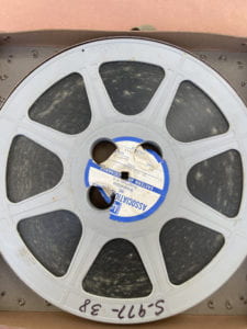 A reel of film with mold, before remediation.