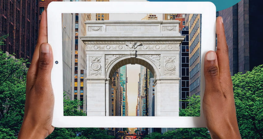 Detail of the 2018 Annual Report cover, hands holding mobile device in front of Washington Square Arch