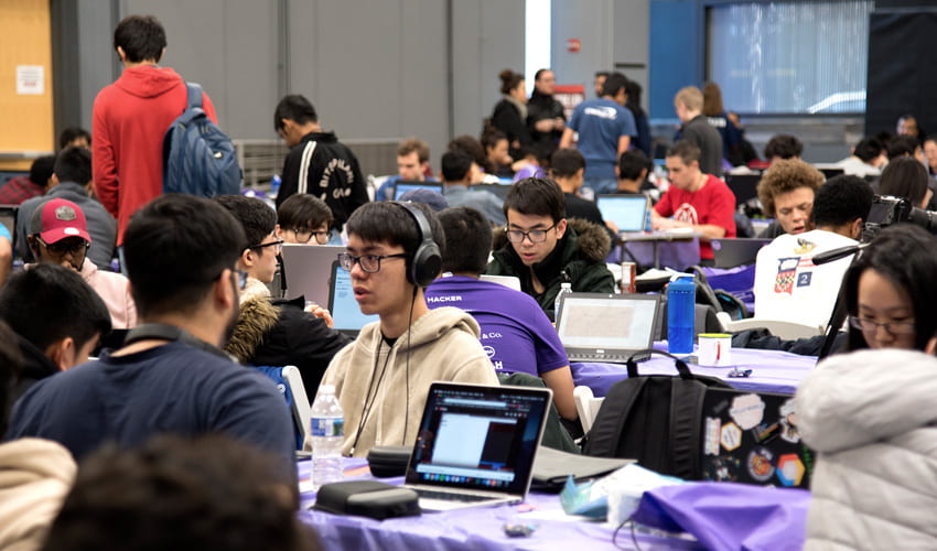 Large crown of HackNYU participants working at their computers