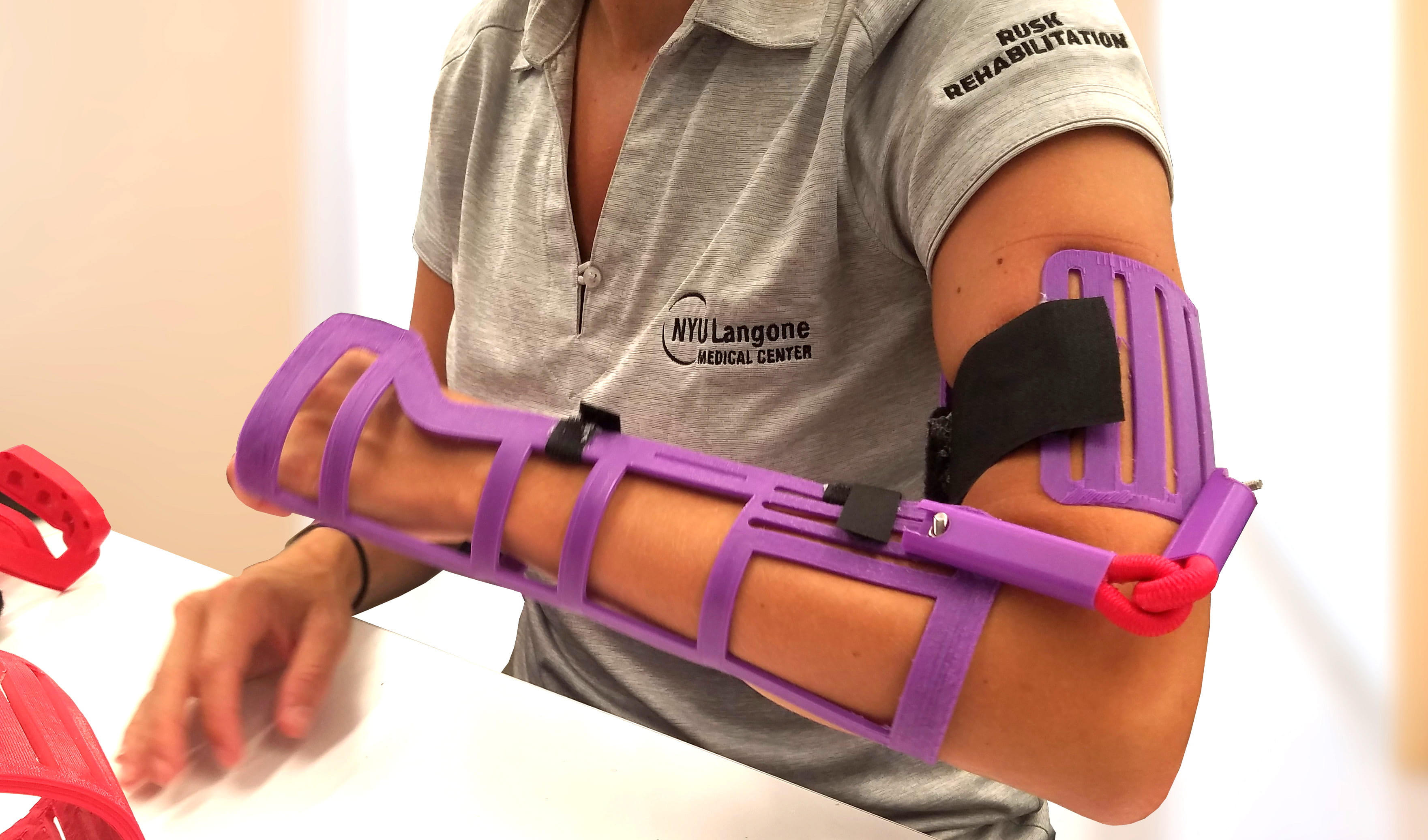 Arm of a MakerBrace researcher wearing a prototype brace