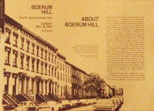 20th century pamphlet displaying a row of brownstone townhouses with cars 