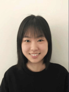 Color portrait of Cathy Xu on a white background, wearing a black sweater.