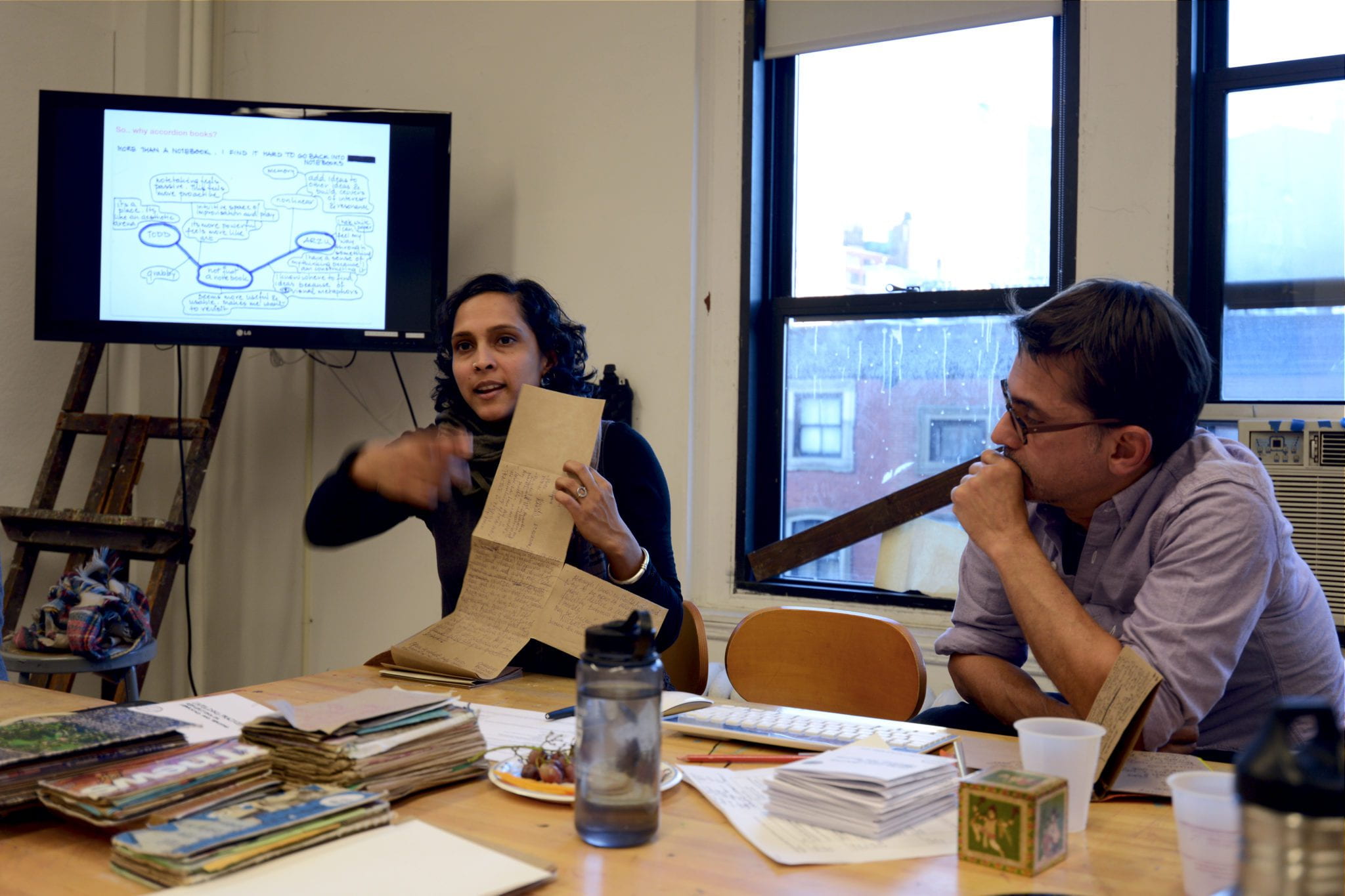 Todd and Arzu leading the Accordion Book Workshop.