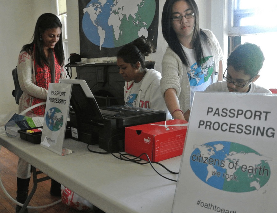 Students running the passport processing documentation center