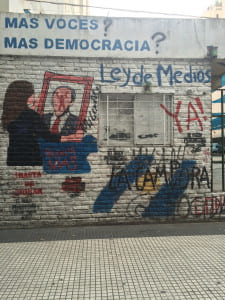 white brick wall with colorful graffiti