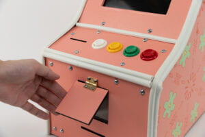 3/4 View of the candy distributor and buttons on the game console