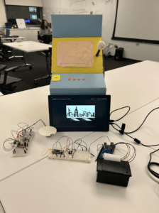 Arcade game prototype with all of its internal mechanisms including dispenser, thermal printer, bread boards, circuits, and monitor