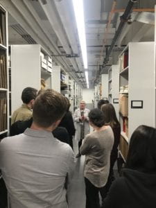 Students listening to archivist at FIT archives