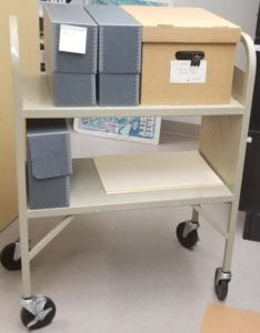 Photograph of trolley with organized archival matierals 