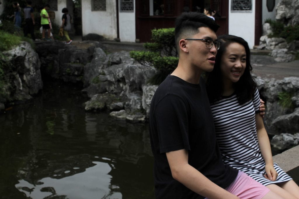 couple in garden near water