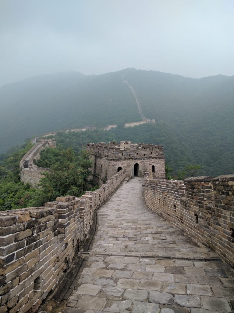 The Great Wall of China stretching up and over a mountain