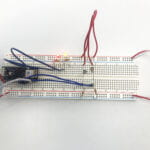 a breadboard with a LED circuit and 2 photocells