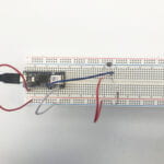 a breadboard with a LED circuit and 2 photocells