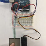 a circuit connected with Arduino, servomotor and FSR