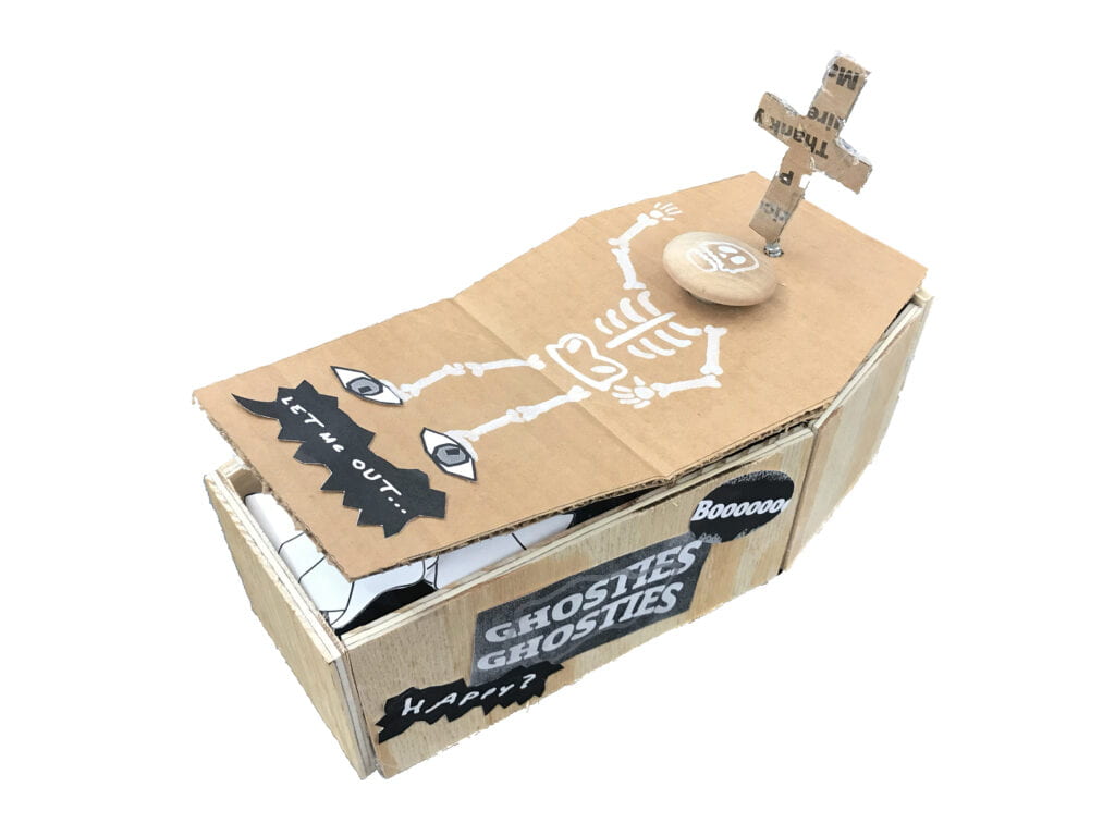 a music box in the shape of a coffin