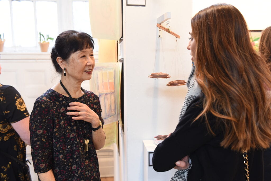 Ikuko speaks with a student