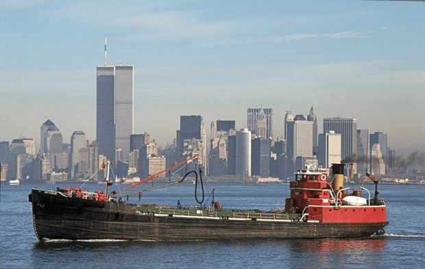 View of Mary A. Whalen ship in New York Harbor, Twin Towers in background.