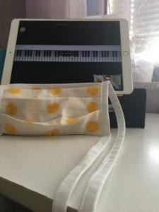 iPad showing piano keys and mask