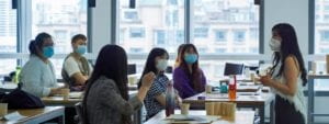 students and professor in masks