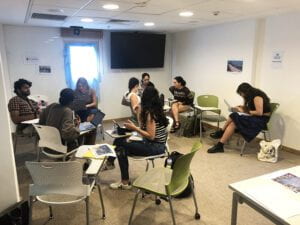 Students seated at desks in a classroom