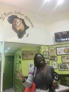 Maureen poses for the camera in El Buen Sabor Africano restaurant