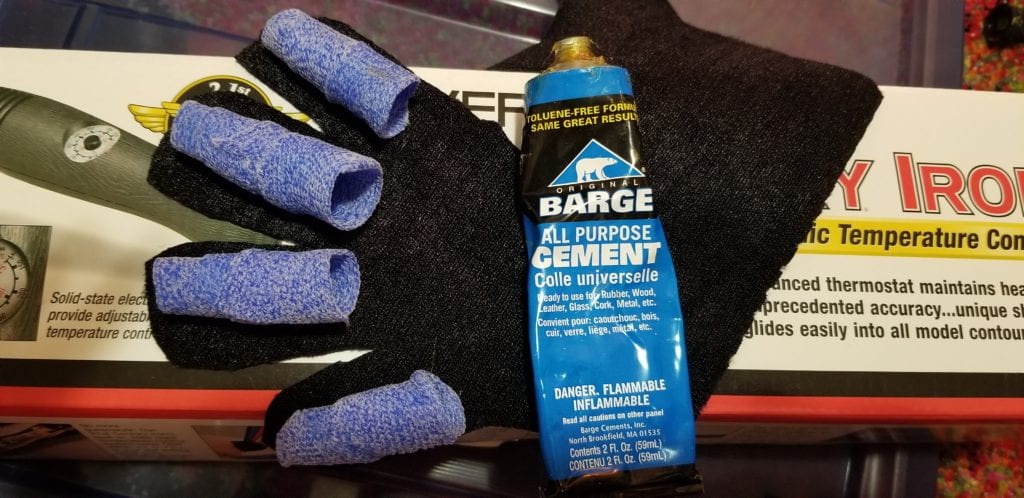 ORFICAST INSERTS GLUED TO GLOVE WITH TUBE OF BARGE CEMENT ALL PURPOSE GLUE BESIDE IT