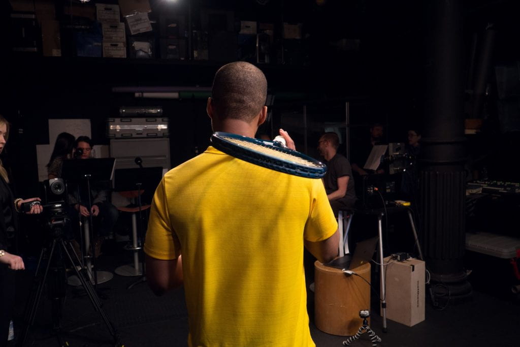 Actors filming in a television studio.