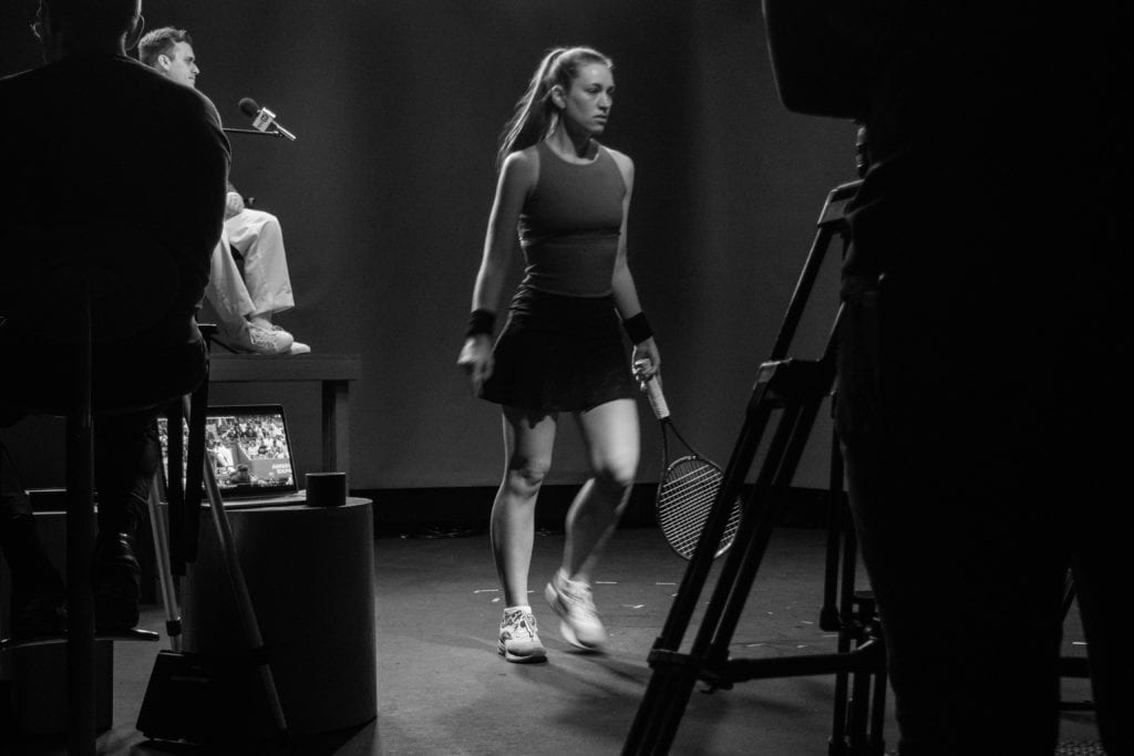 Actors filming in a television studio.