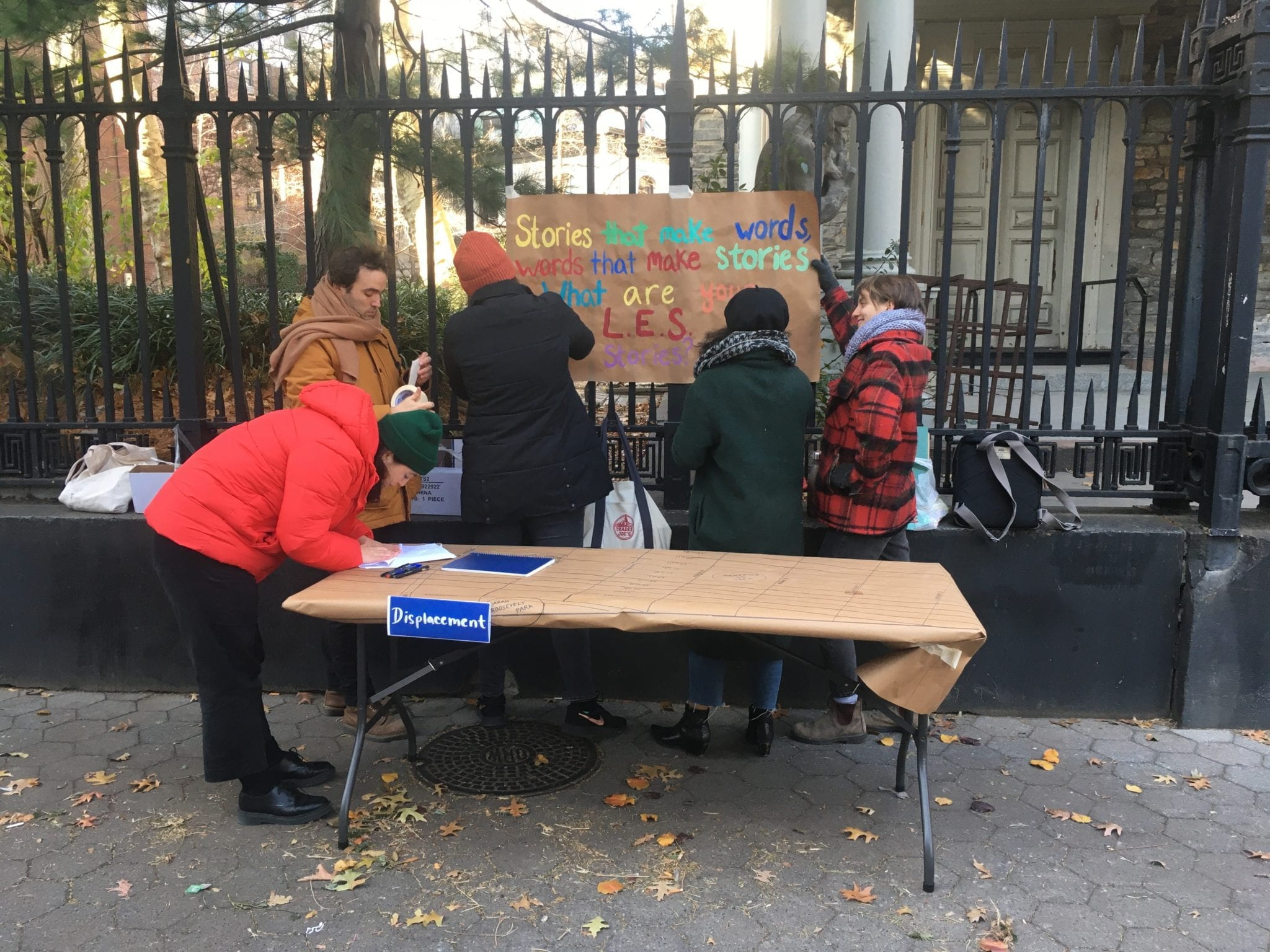 Grad students setting up their table for a workshop outside of St. Mark's.