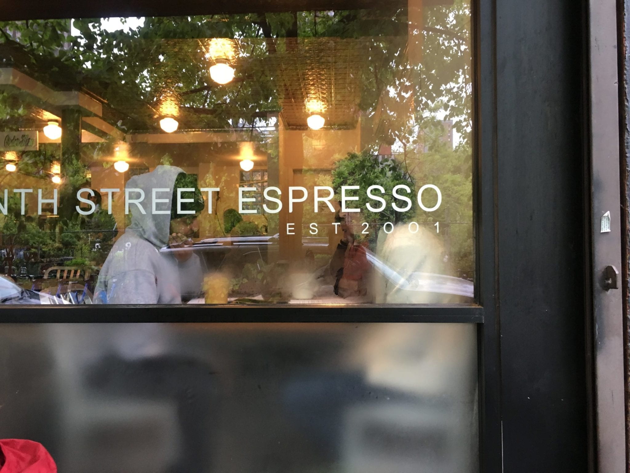 Two people having a conversation in a coffee shop