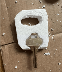 Metal key embedded in foam square to add extra support. 