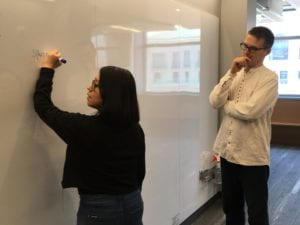 Mendoza and Lostanlen working at the whiteboard